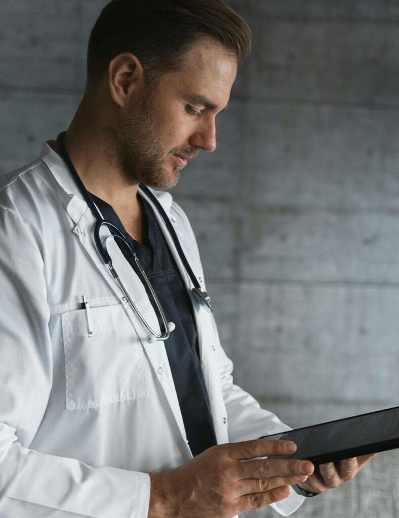 doctor looking at tablet