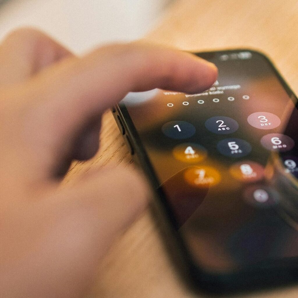 iphone with hand demonstrating security
