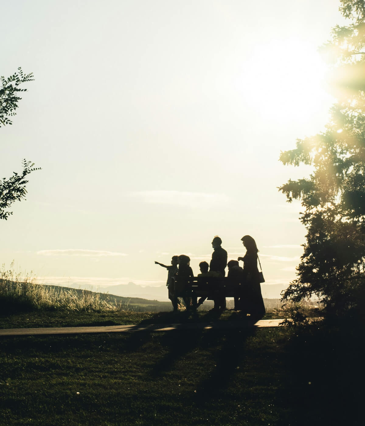 silhouette of family at sunset